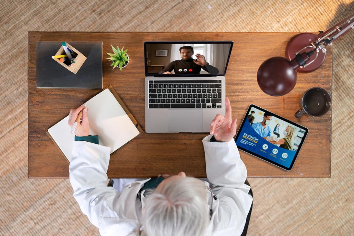 Health care worker in office having a telehealth consultation